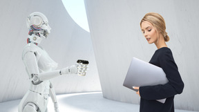 Woman with laptop standing next to android robot