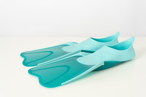 Blue swimming fins on a white background