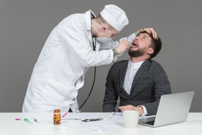 A doctor checking a patient