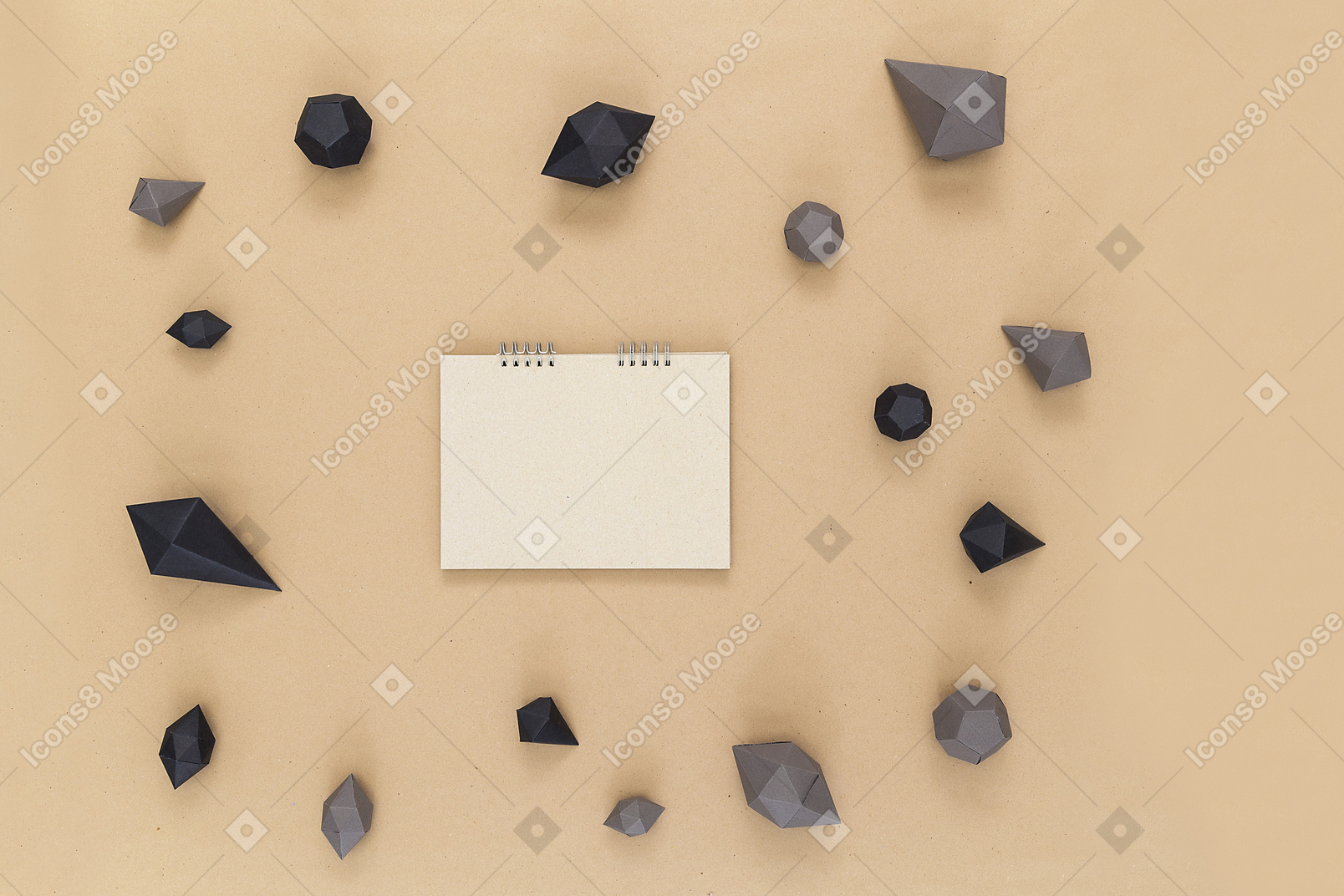 Book lying in the middle of the circle of black and brown objects