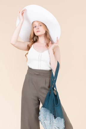 Welcoming summer time with white hat accessory