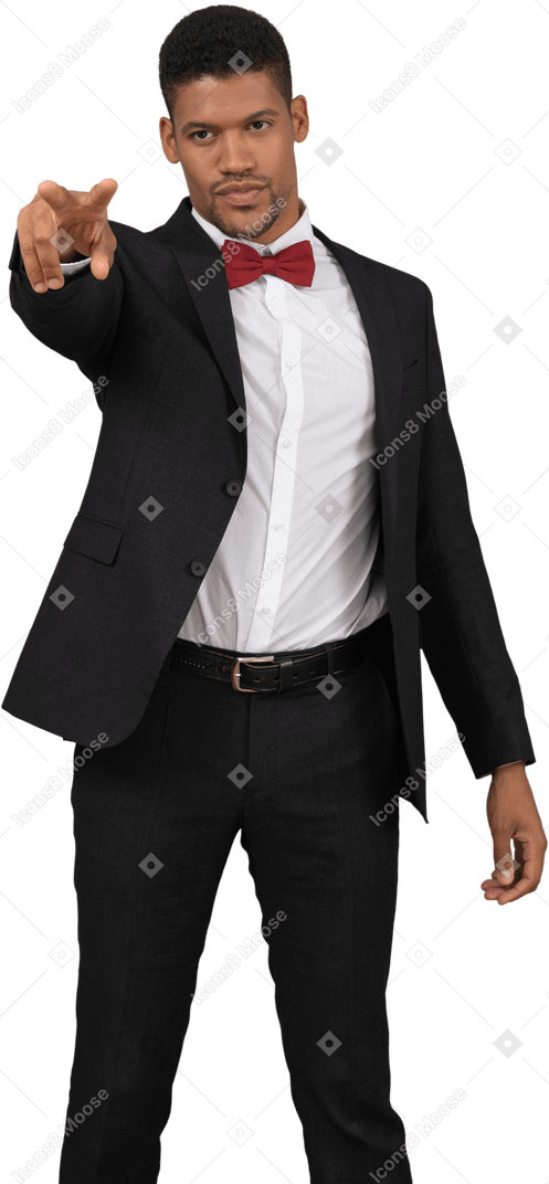 Man in black suit pointing