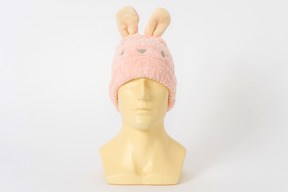 Pink bunny hat on a mannequin head