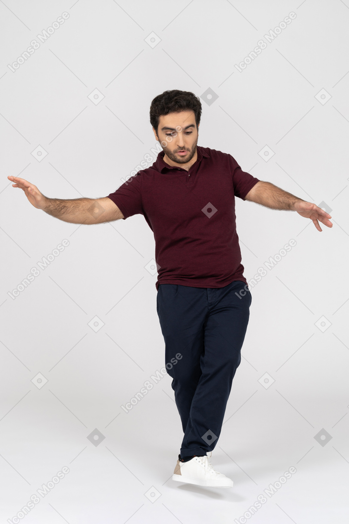Man in casual clothes balance walking