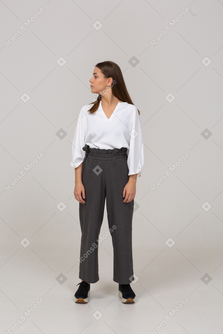Front view of a young lady in office clothing looking to the left