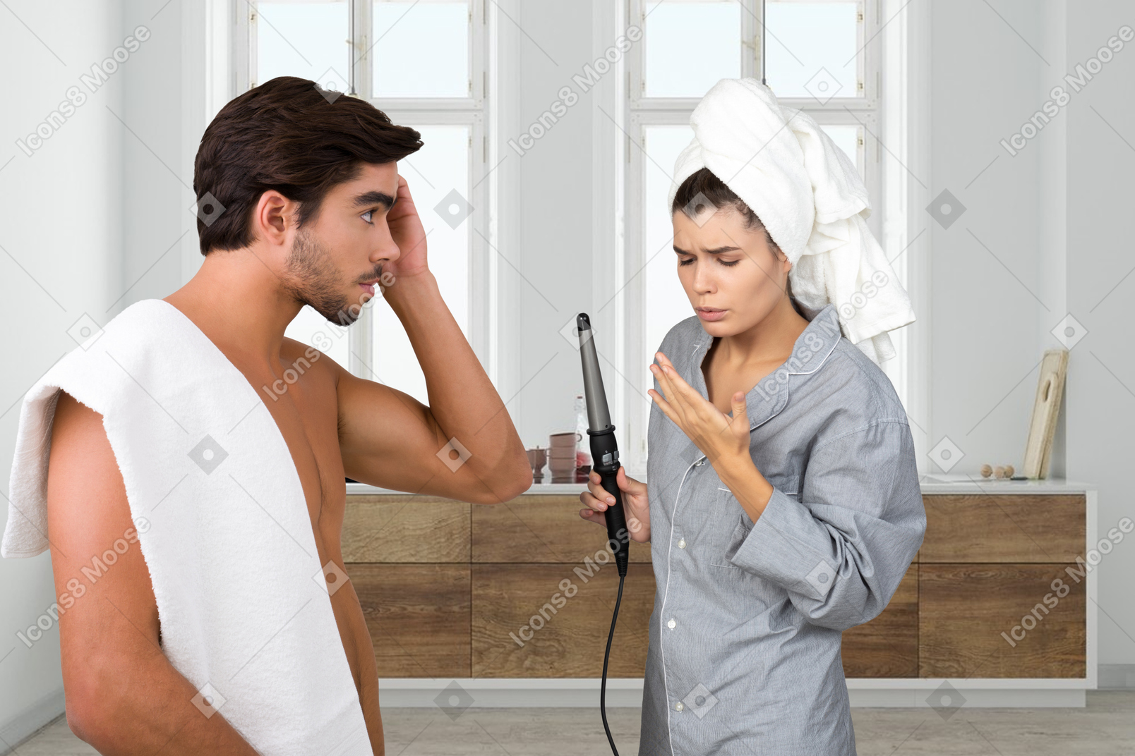 Topless man with towel on his shoulder standing next to woman blowing burned finger in bathroom