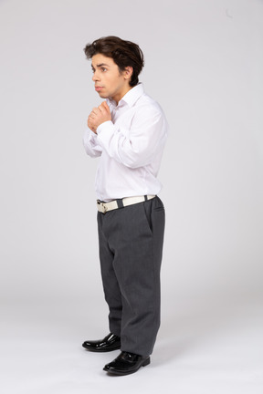 Worried man standing with folded hands