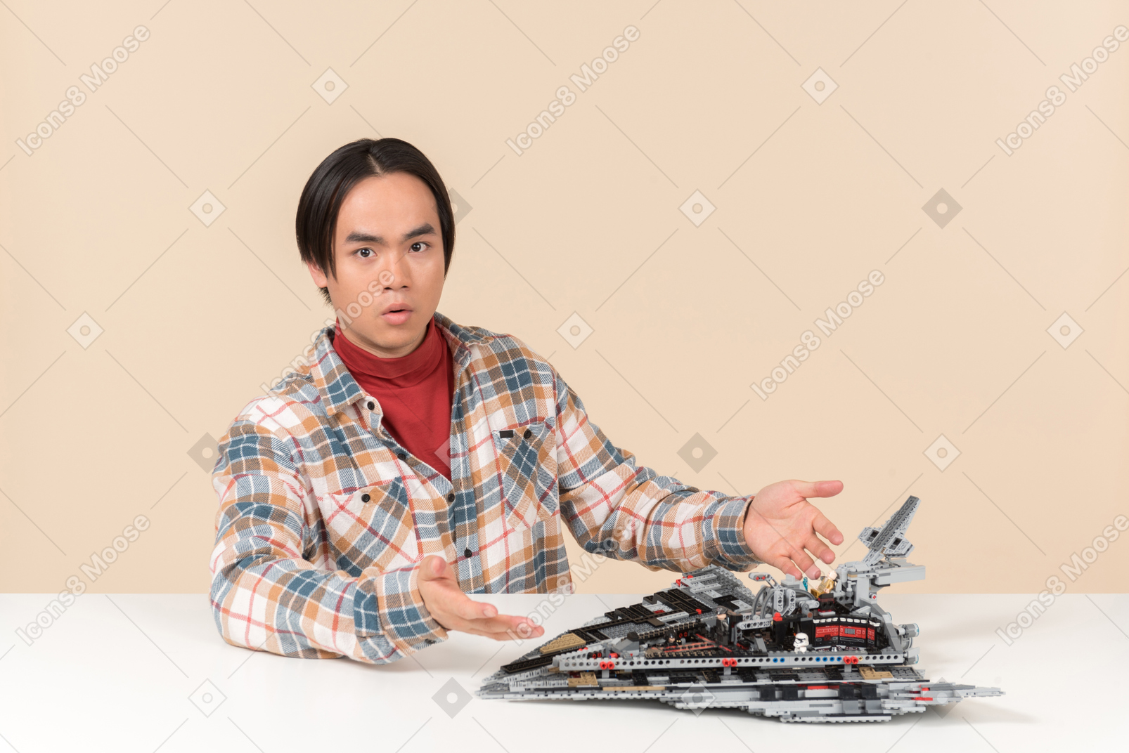 An asian geek guy in a checkered shirt