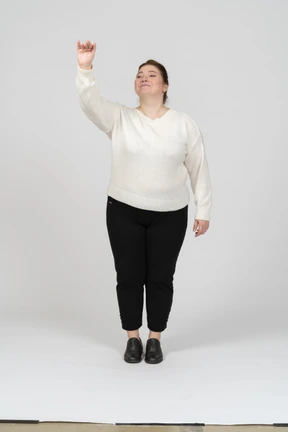 Front view of a plus size woman in casual clothes greeting someone