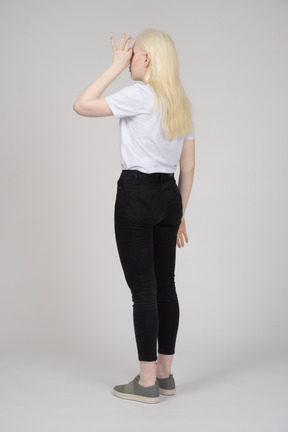 A woman in black pants and a white shirt