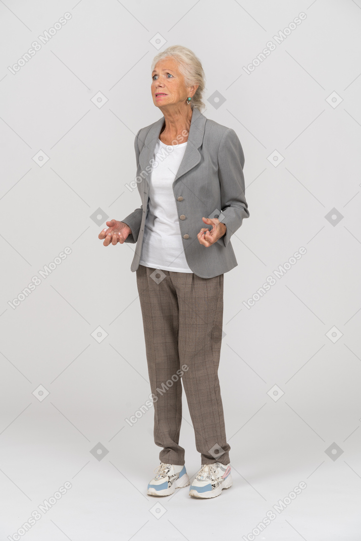 Front view of an old lady in grey jacket
