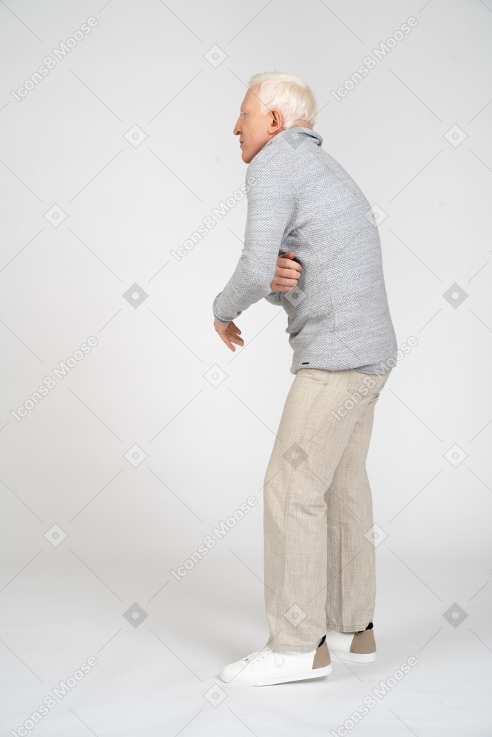 Man holding stomach and leaning over