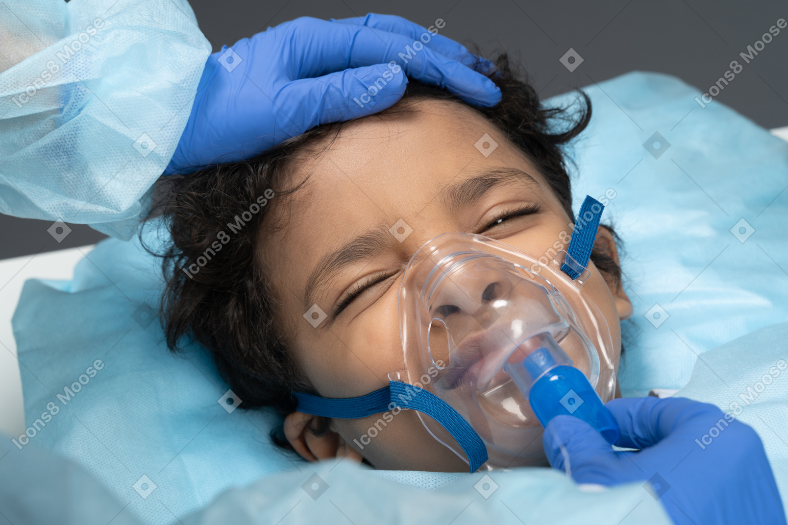 Little boy in the oxygen mask