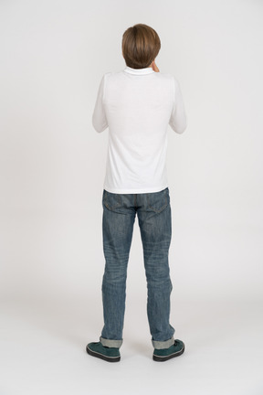 Young man in casual clothes standing