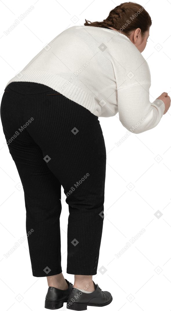 Rear view of plump woman in casual clothes bending down