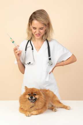 Attractive veterinarian wrinkling her nose