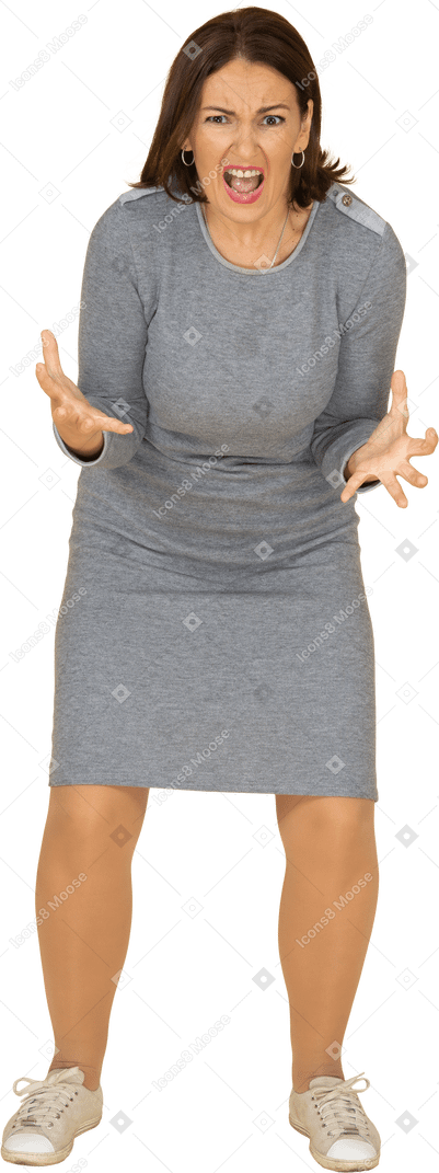 Front view of an angry woman in grey dress