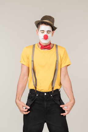 Male clown showing empty pockets