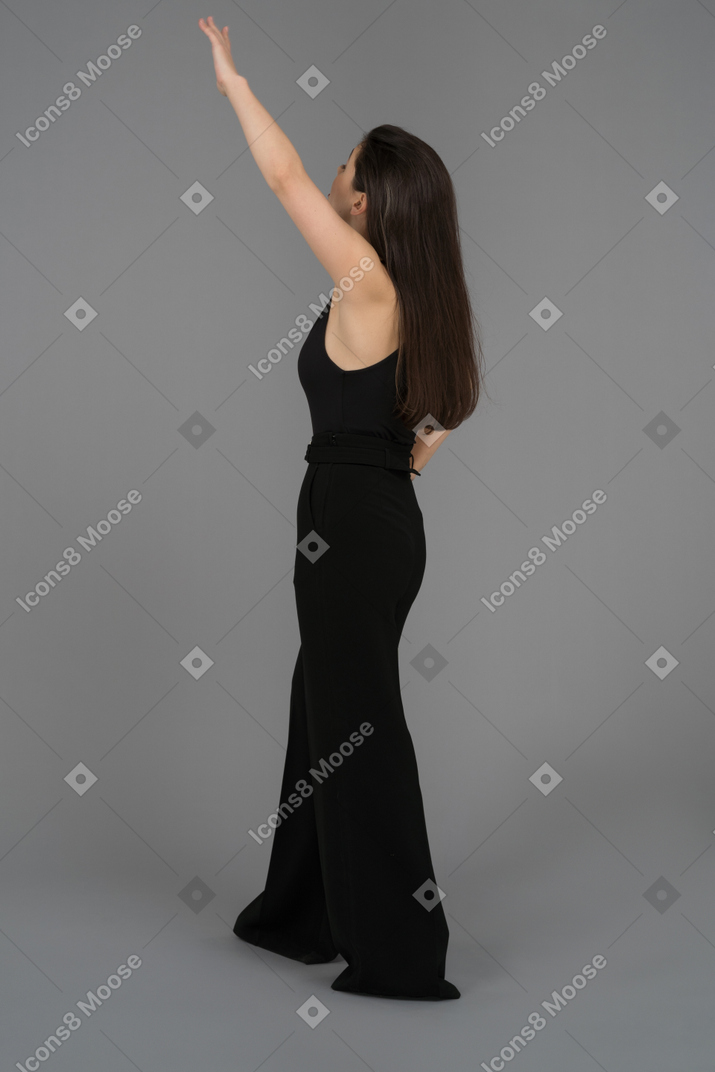 A woman raising one hand