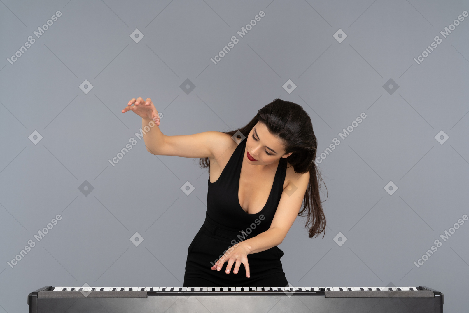 Passionate young woman striking the notes