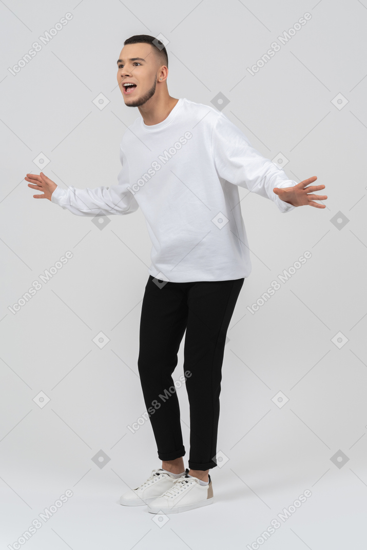 Young man in casual clothes looking excited