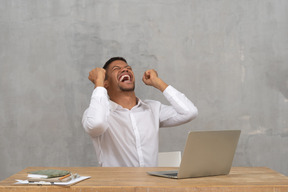 Excited man with closed eyes