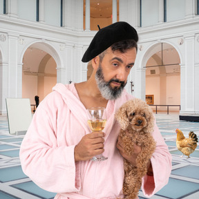A man in a pink robe holding a dog