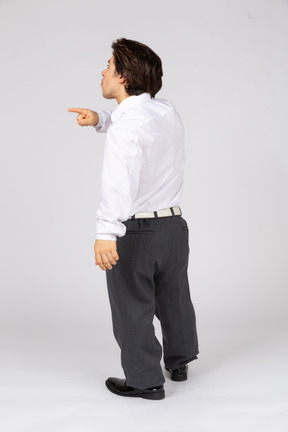 Back view of young man gesturing