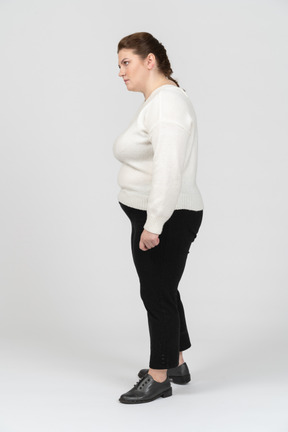 Plump woman in casul clothes standing