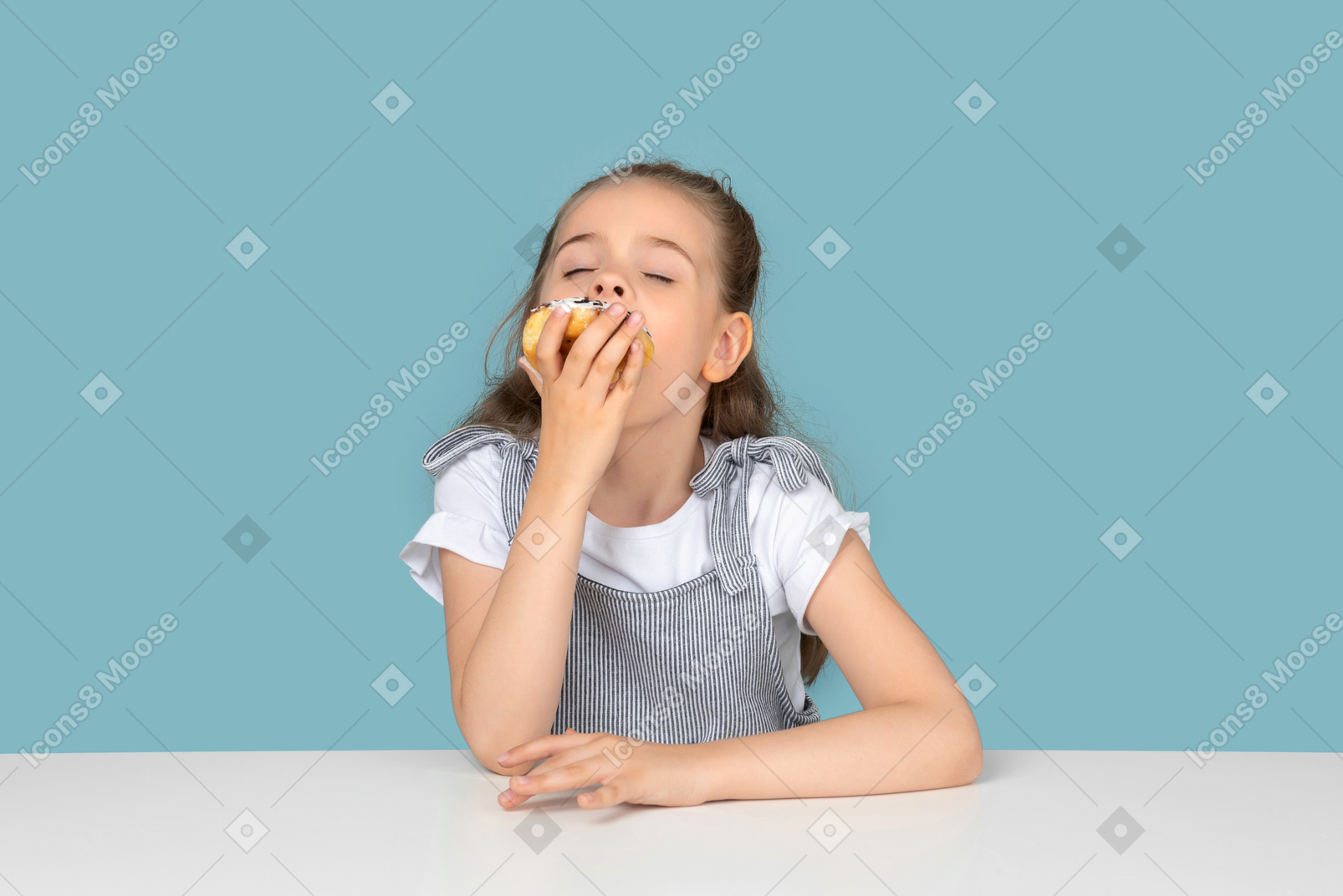 Cute little girl enjoying a doughnut