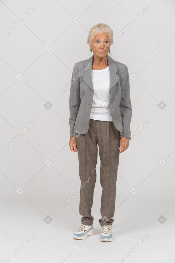 Front view of an old lady in grey jacket