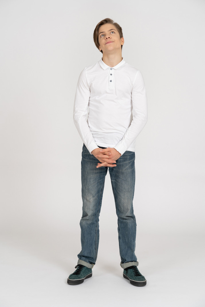 Young man in casual clothes standing