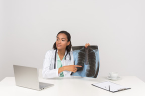 Beautiful female doctor with an x-ray photograph