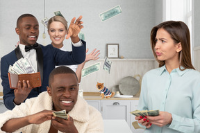 Men standing in the kitchen next to women and throwing money