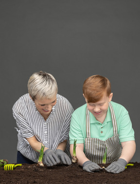 Mother and son gardening