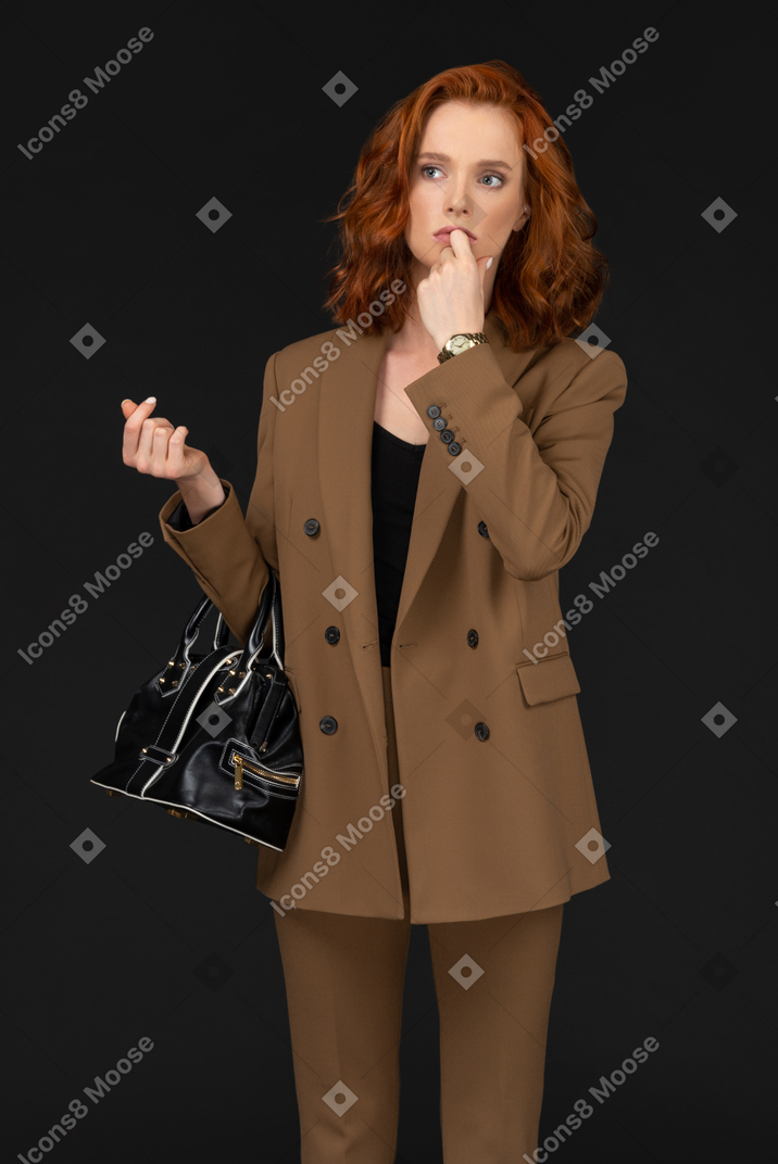 Front view of a businesswoman thinking