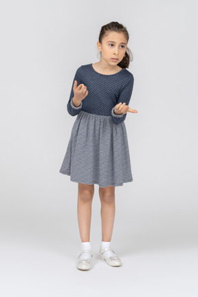 Front view of a girl gesturing in confusion
