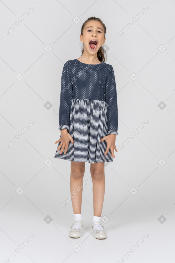 Front view of a girl with mouth wide open as if screaming