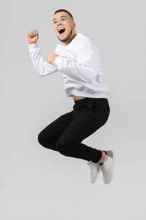 Happy young man jumping