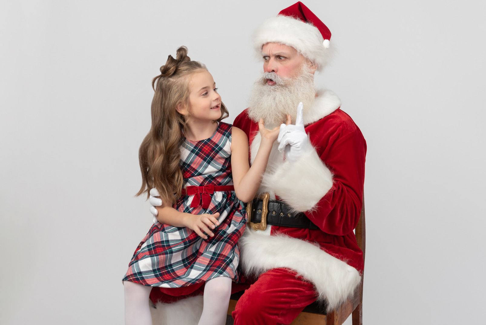 Santa pointing out that kid girl can't touch his beard