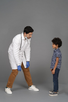 Doctor and boy looking at each other