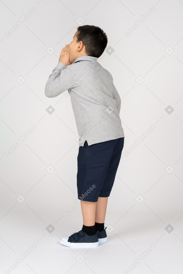 Boy calling for someone