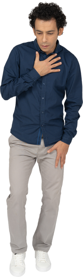 Front view of a man in casual clothes posing