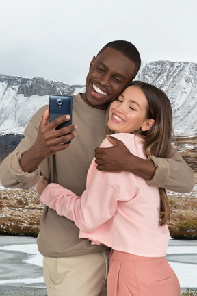 A man and a woman taking a selfie
