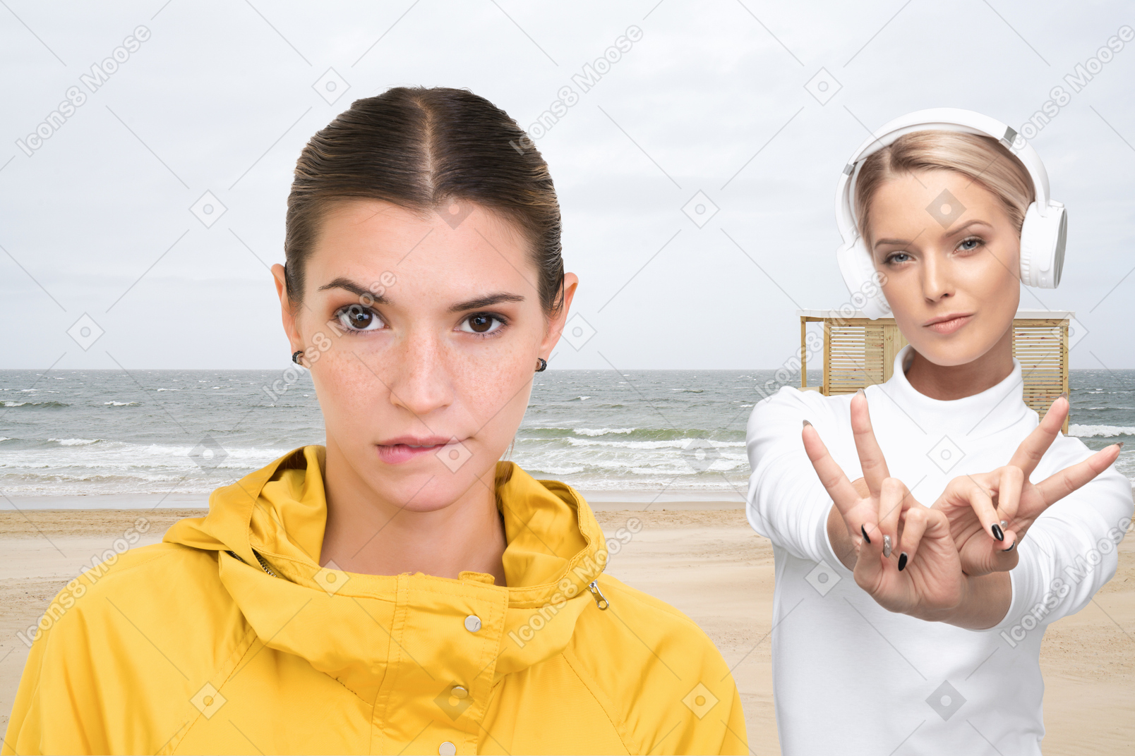 A woman making a peace sign next to another woman on the beach