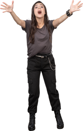 Front view of a surprised female rocker outstretching her hands