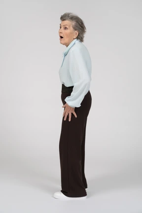 Side view of an old woman looking shocked