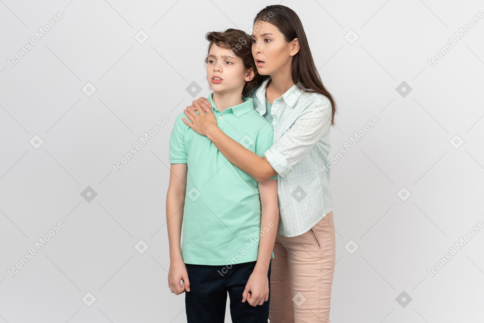 Alarmed mother hugging her son