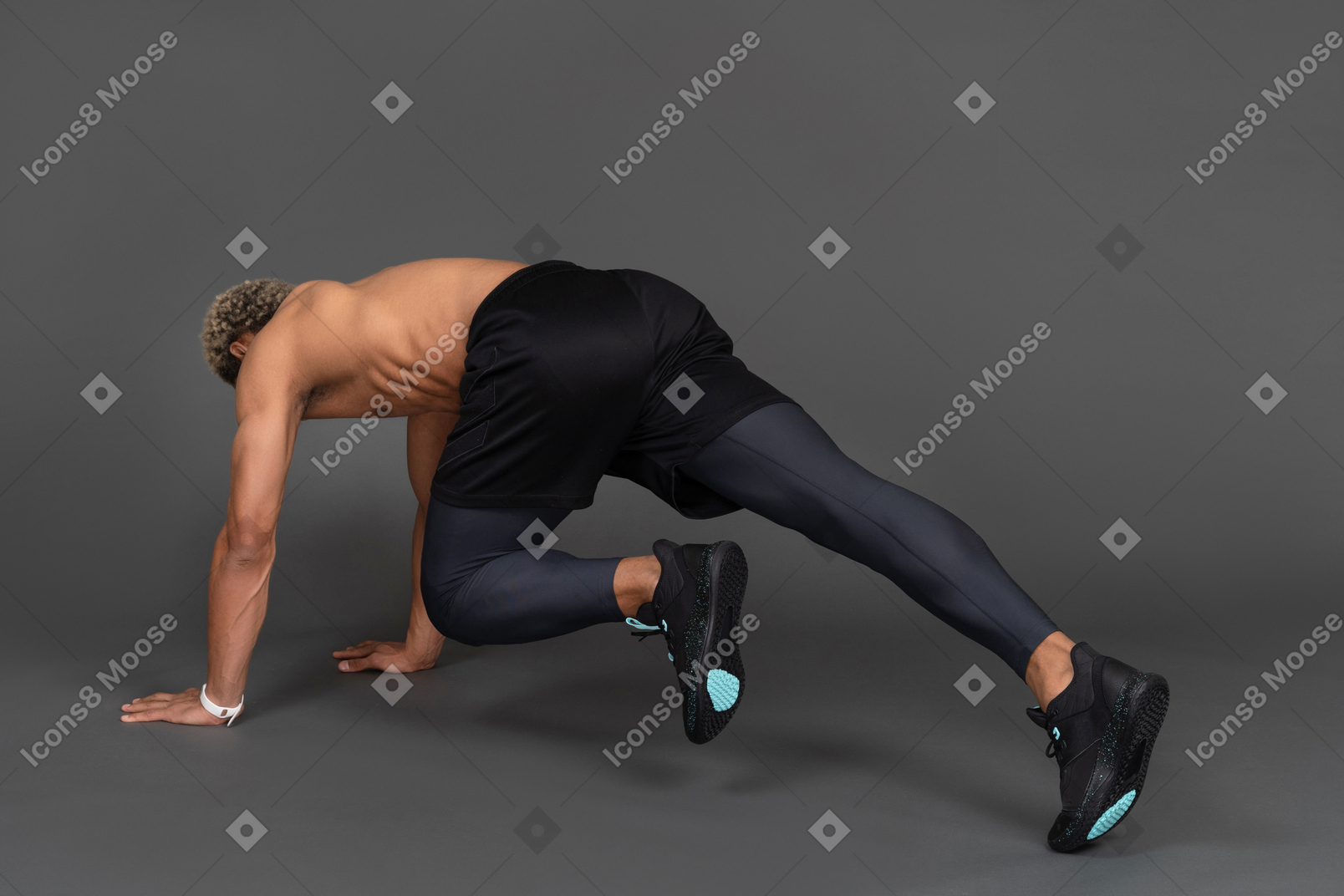 Three-quarter back view of a shirtless afro man making plank and raising leg