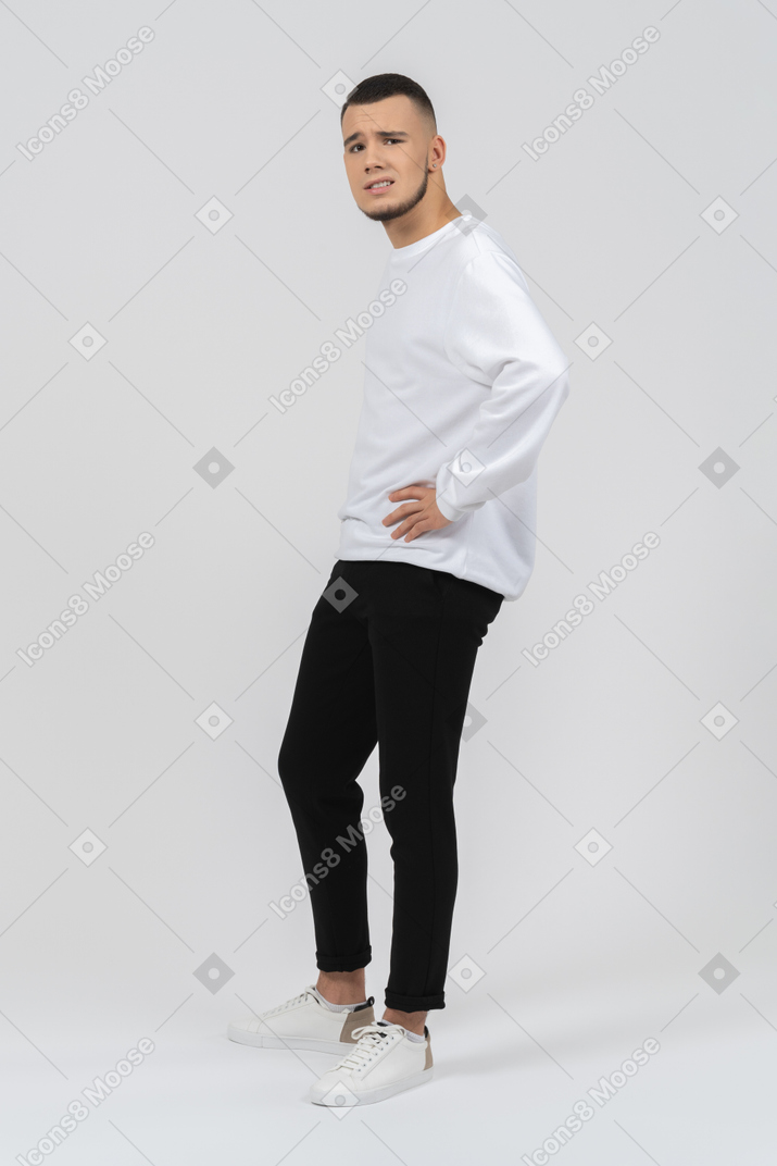 Man in casual clothes smiling awkwardly